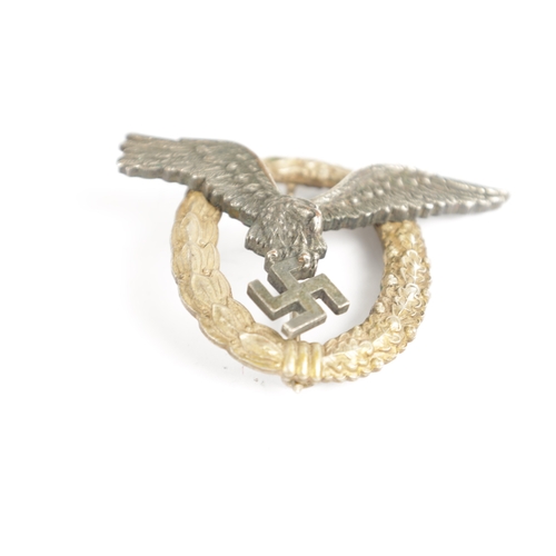 535 - A WW2 GERMAN LUFTWAFFE PILOT'S BADGE with riveted eagle enclosed by a wreath, marked 