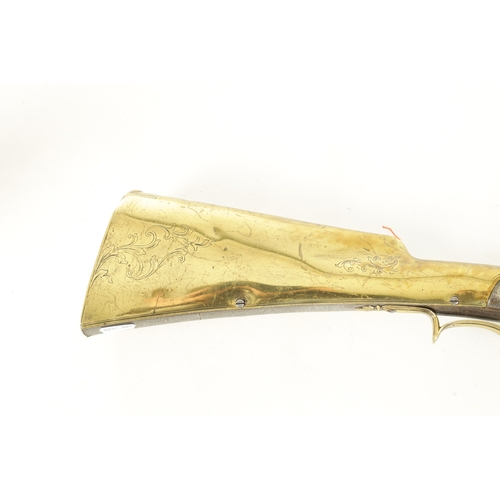 536 - AN UNUSUAL LATE 18TH CENTURY FLINTLOCK SPORTING GUN WITH BRASS STOCK having a 34