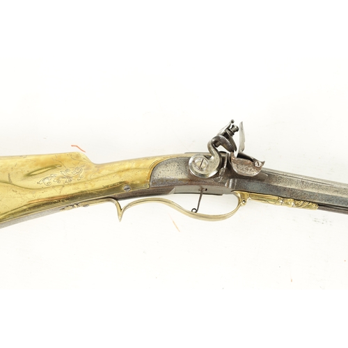 536 - AN UNUSUAL LATE 18TH CENTURY FLINTLOCK SPORTING GUN WITH BRASS STOCK having a 34