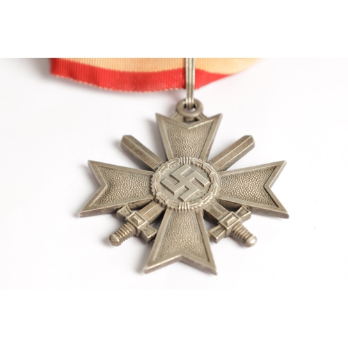 538 - A GERMAN WW2 SILVER KNIGHT'S CROSS OF THE WAR - MERIT CROSS WITH SWORDS ribbon mounted, marked 