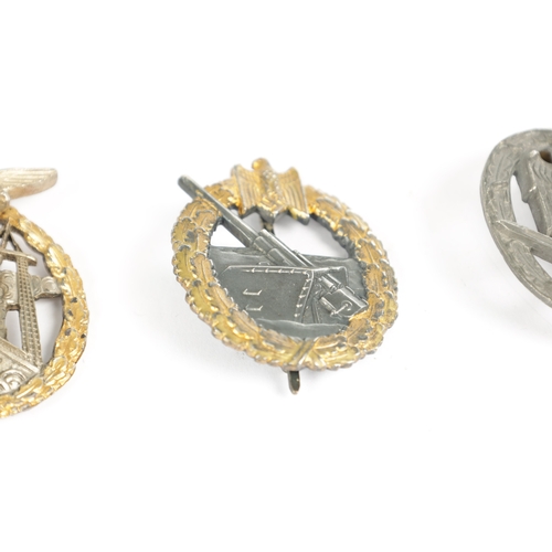 542 - A COLLECTION OF THREE WW2 GERMAN THIRD REICH BADGES comprising a A WW2 GERMAN THIRD REICH KRIEGSMARI... 