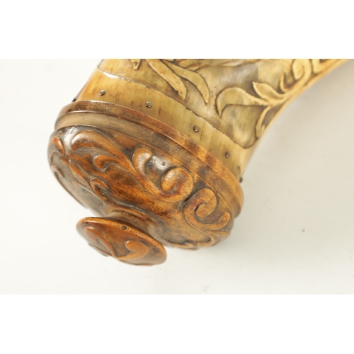 556 - AN UNUSUAL 19TH CENTURY AMERICAN CARVED HORN POWDER FLASK finely carved with mountain and landscape ... 