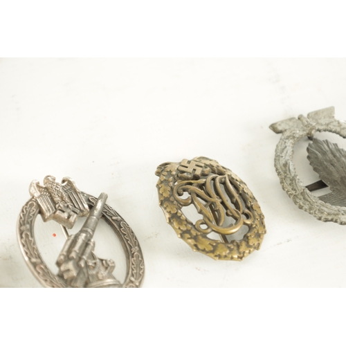 557 - A COLLECTION OF SIX WWII NAZI GERMAN BADGES comprising of two Eagle cap badges, a bronze Sports badg... 