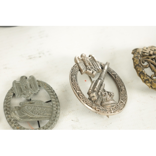 557 - A COLLECTION OF SIX WWII NAZI GERMAN BADGES comprising of two Eagle cap badges, a bronze Sports badg... 