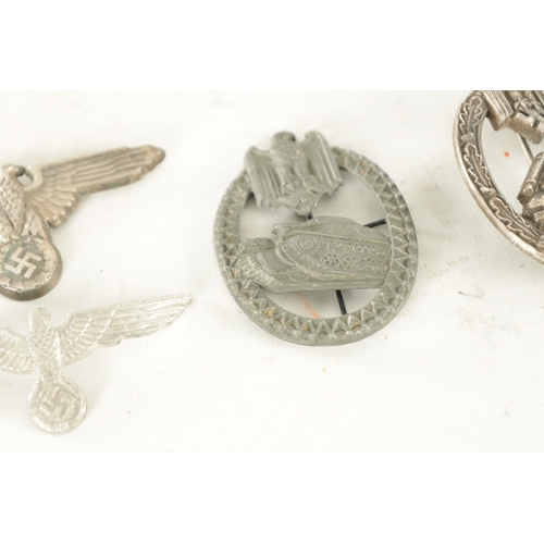 557 - A COLLECTION OF SIX WWII NAZI GERMAN BADGES comprising of two Eagle cap badges, a bronze Sports badg... 