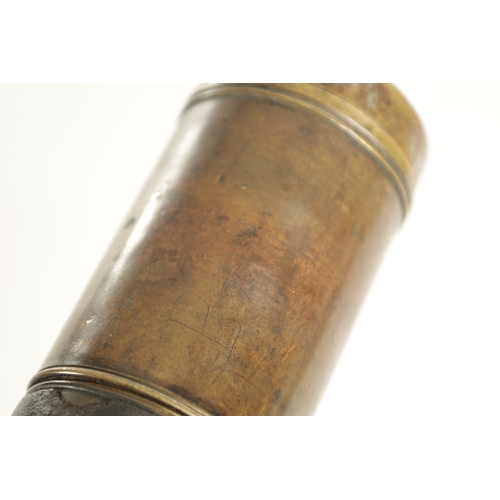 563 - A 19TH CENTURY LEATHER BAND SINGLE DRAW BRASS OFFICER'S TELESCOPE with extending lens shade and indi... 