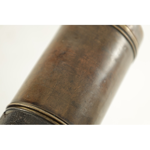 563 - A 19TH CENTURY LEATHER BAND SINGLE DRAW BRASS OFFICER'S TELESCOPE with extending lens shade and indi... 