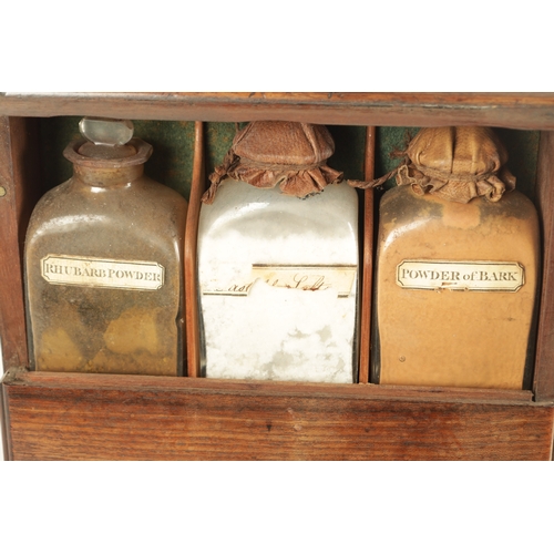 565 - A GEORGE III MAHOGANY APOTHECARY BOX with a hinged front revealing a medicine bottle and two fitted ... 