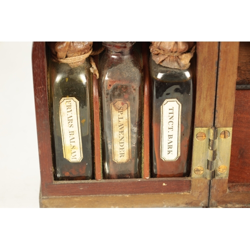 565 - A GEORGE III MAHOGANY APOTHECARY BOX with a hinged front revealing a medicine bottle and two fitted ... 