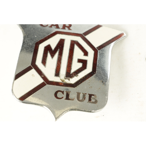 587 - A COLLECTION OF THREE VINTAGE CHROME PLATED ENAMEL CAR BADGES, comprising of an MG car club badge, a... 