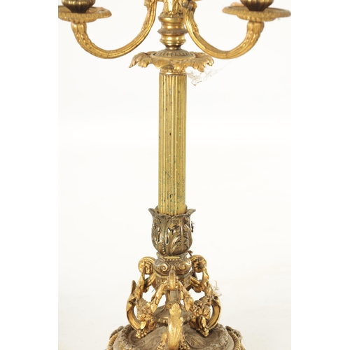 599 - A PAIR OF LATE 19TH CENTURY FRENCH ORMOLU AND WHITE MARBLE THREE BRANCH CANDELABRA with ram's head m... 