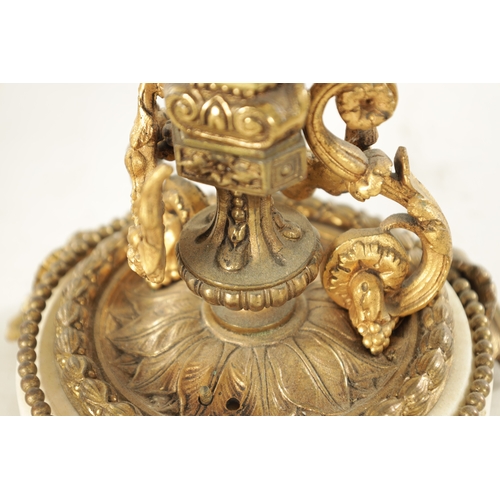 599 - A PAIR OF LATE 19TH CENTURY FRENCH ORMOLU AND WHITE MARBLE THREE BRANCH CANDELABRA with ram's head m... 