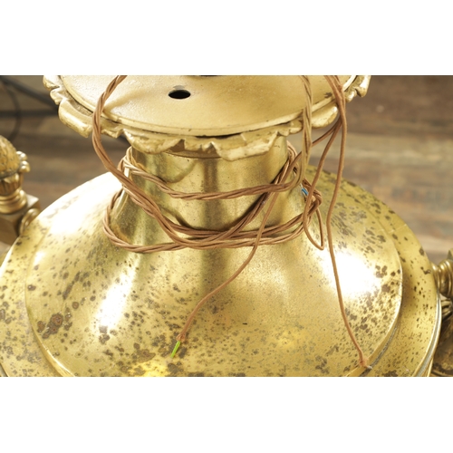 604 - A LARGE PAIR OF EDWARDIAN GILT BRASS HANGING LANTERNS with shaped tops and pineapple finials each ha... 