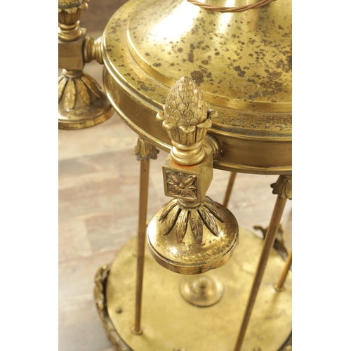 604 - A LARGE PAIR OF EDWARDIAN GILT BRASS HANGING LANTERNS with shaped tops and pineapple finials each ha... 