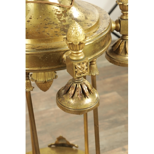 604 - A LARGE PAIR OF EDWARDIAN GILT BRASS HANGING LANTERNS with shaped tops and pineapple finials each ha... 