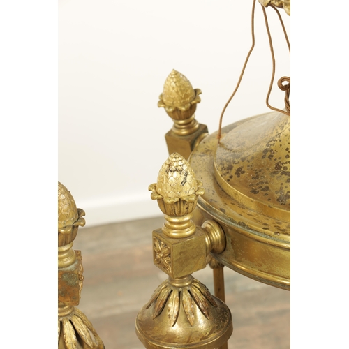 604 - A LARGE PAIR OF EDWARDIAN GILT BRASS HANGING LANTERNS with shaped tops and pineapple finials each ha... 