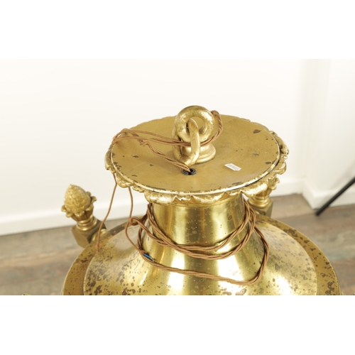 604 - A LARGE PAIR OF EDWARDIAN GILT BRASS HANGING LANTERNS with shaped tops and pineapple finials each ha... 