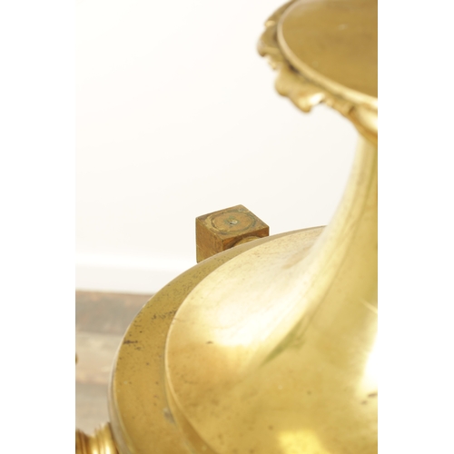 604 - A LARGE PAIR OF EDWARDIAN GILT BRASS HANGING LANTERNS with shaped tops and pineapple finials each ha... 