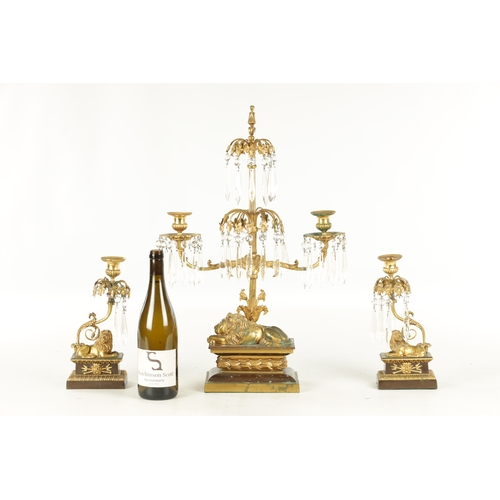 606 - A 19TH CENTURY FRENCH BRONZE AND ORMOLU THREE PIECE CANDELABRA GARNITURE, the centrepiece with cut g... 