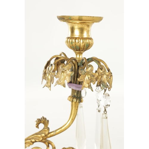 606 - A 19TH CENTURY FRENCH BRONZE AND ORMOLU THREE PIECE CANDELABRA GARNITURE, the centrepiece with cut g... 