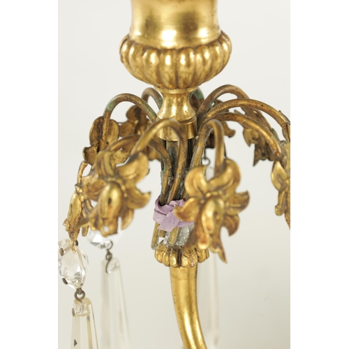 606 - A 19TH CENTURY FRENCH BRONZE AND ORMOLU THREE PIECE CANDELABRA GARNITURE, the centrepiece with cut g... 