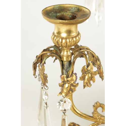 606 - A 19TH CENTURY FRENCH BRONZE AND ORMOLU THREE PIECE CANDELABRA GARNITURE, the centrepiece with cut g... 