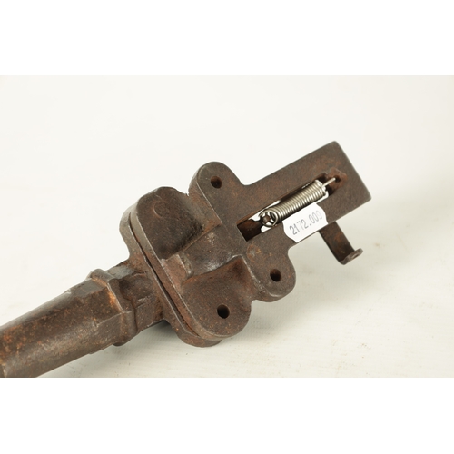 607 - A 19TH CENTURY BRONZE MODEL OF A STARTER CANNON on cast brass carriage TOGETHER WITH A CAST IRON STA... 