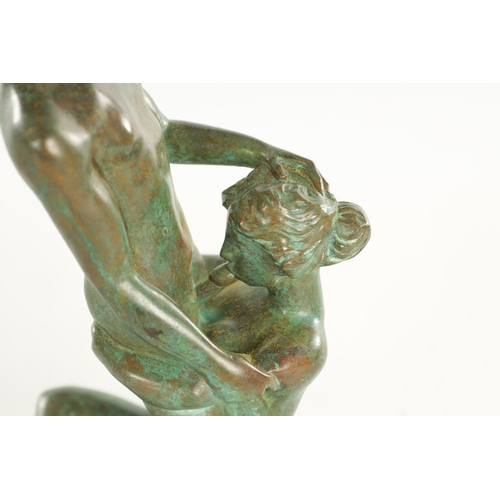 620 - A 20TH CENTURY FRENCH GREEN-PATINATED EROTIC BRONZE SCULPTURE depicting lovers (24.5cm high)