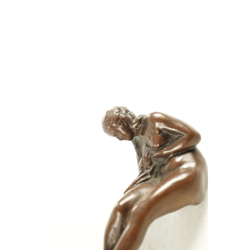 621 - AN ART NOVEAU FRENCH BRONZE DESK SEAL depicting a semi-clad nude female mounted on a striated coffee... 