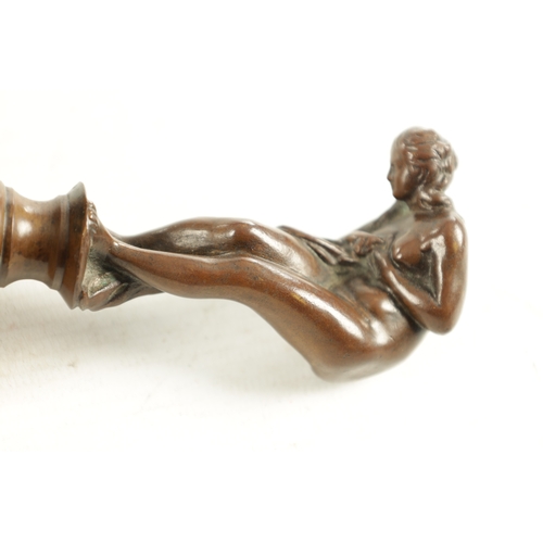 621 - AN ART NOVEAU FRENCH BRONZE DESK SEAL depicting a semi-clad nude female mounted on a striated coffee... 