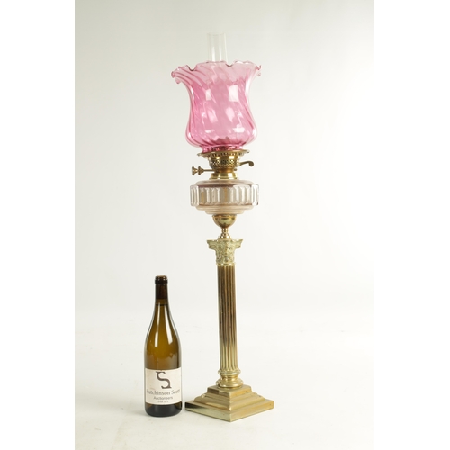 622 - A VICTORIAN SQUARE-BASE BRASS OIL LAMP with Corinthian column stem, etched cut glass clear reservoir... 