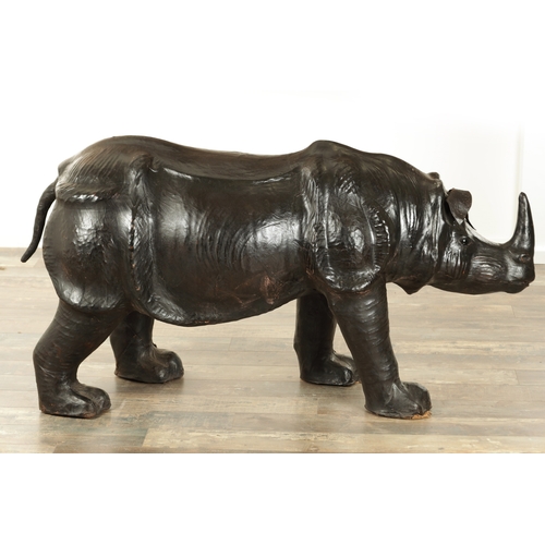 628 - A LARGE LIBERTY STYLE LEATHER BOUND MODEL OF A RHINO (140cm wide 52cm wide)