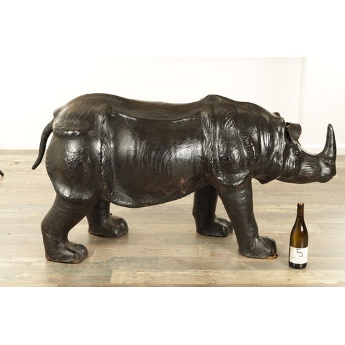 628 - A LARGE LIBERTY STYLE LEATHER BOUND MODEL OF A RHINO (140cm wide 52cm wide)