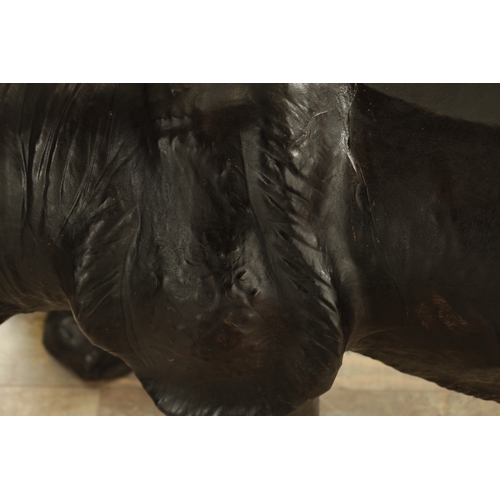 628 - A LARGE LIBERTY STYLE LEATHER BOUND MODEL OF A RHINO (140cm wide 52cm wide)