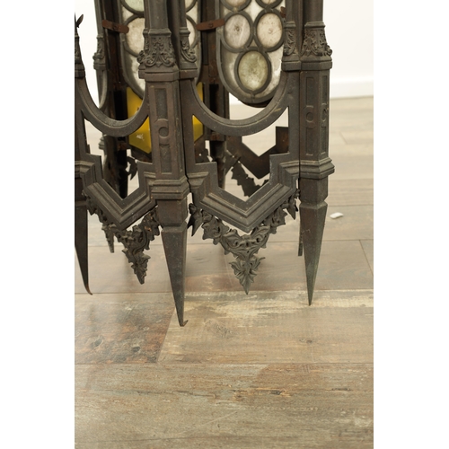 642 - A PAIR OF LATE 19TH CENTURY BRONZE GOTHIC STYLE HANGING LANTERNS the hexagonal shaped bodies with sp... 