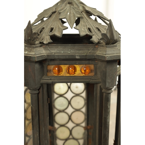 642 - A PAIR OF LATE 19TH CENTURY BRONZE GOTHIC STYLE HANGING LANTERNS the hexagonal shaped bodies with sp... 