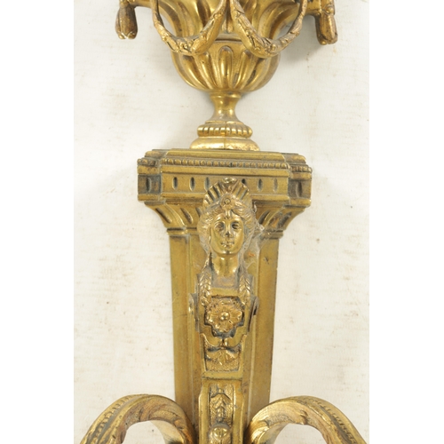 644 - A PAIR OF LATE 19TH CENTURY GILT BRASS ADAM STYLE THREE BRANCH WALL HANGING CANDELABRA with urn fini... 