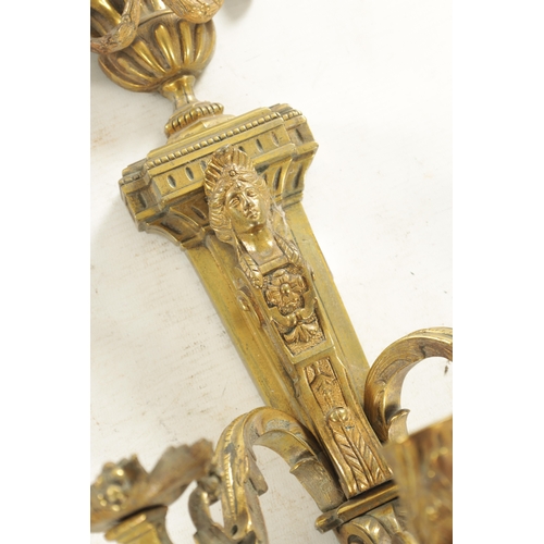 644 - A PAIR OF LATE 19TH CENTURY GILT BRASS ADAM STYLE THREE BRANCH WALL HANGING CANDELABRA with urn fini... 