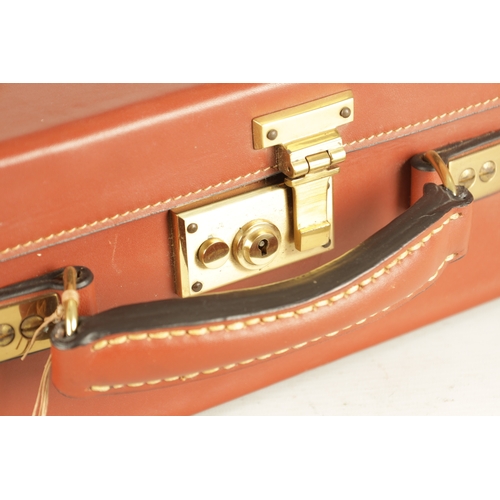 646 - A JOHN RIGBY & CO. PALL MALL LONDON LEATHER AND OAK CARTRIDGE CASE, having brass mounted corners and... 