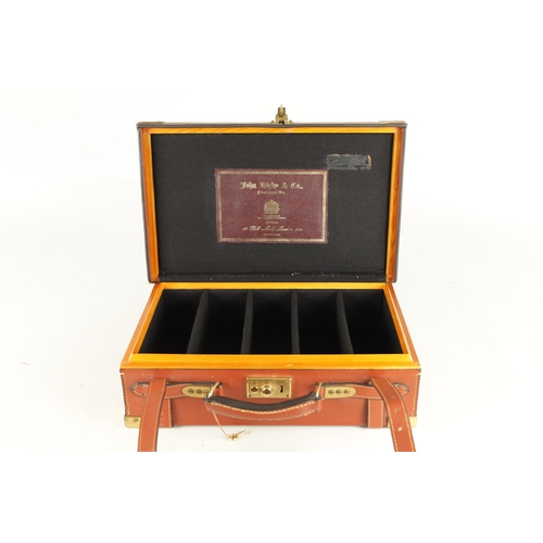 646 - A JOHN RIGBY & CO. PALL MALL LONDON LEATHER AND OAK CARTRIDGE CASE, having brass mounted corners and... 