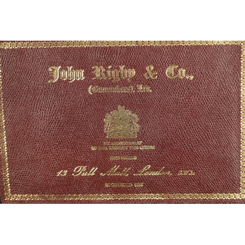 646 - A JOHN RIGBY & CO. PALL MALL LONDON LEATHER AND OAK CARTRIDGE CASE, having brass mounted corners and... 