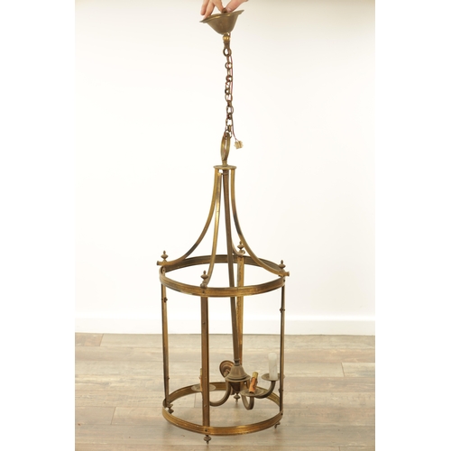 647 - A 20TH CENTURY BRASS HANGING LANTERN of circular form with splayed hanging brackets (81cm high )