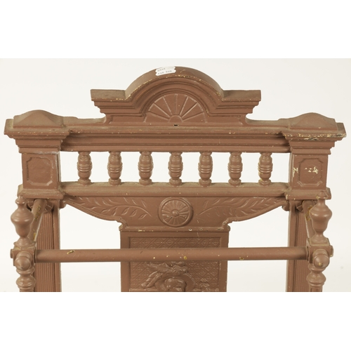 664 - A 19TH CENTURY PAINTED CAST IRON COALBROOKDALE STYLE STICK STAND with galleried shaped pediment abov... 