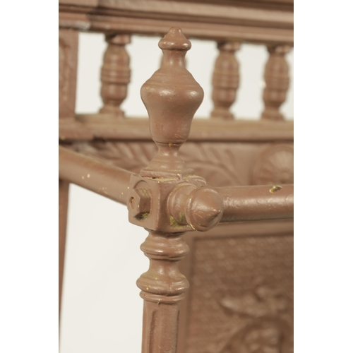 664 - A 19TH CENTURY PAINTED CAST IRON COALBROOKDALE STYLE STICK STAND with galleried shaped pediment abov... 