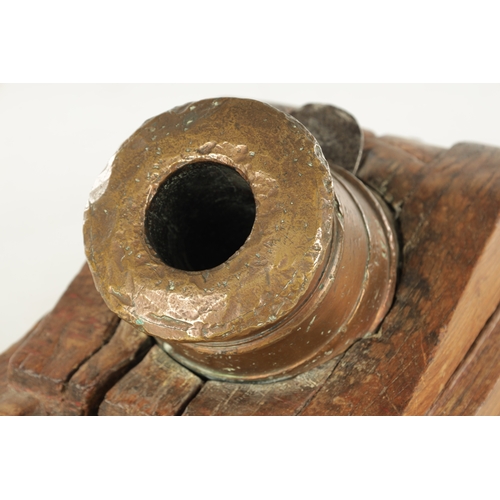 665 - AN 18TH CENTURY BRONZE MORTAR CANON STAMPED M MAVRIER DATED 1753 with coat of arms mounted on a cont... 