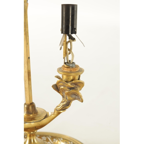 672 - A 20TH CENTURY BRASS TABLE LAMP with adjustable painted shade (76cm high)