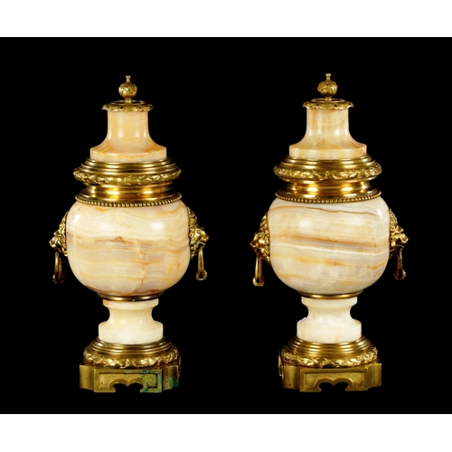 674 - A PAIR OF LATE 19TH CENTURY ONYX AND ORMOLU MOUNTED CASSOLETTES of unusual shape with bulbous bodies... 