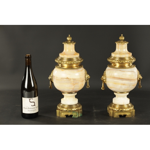 674 - A PAIR OF LATE 19TH CENTURY ONYX AND ORMOLU MOUNTED CASSOLETTES of unusual shape with bulbous bodies... 