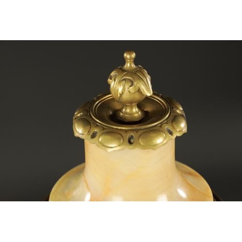 674 - A PAIR OF LATE 19TH CENTURY ONYX AND ORMOLU MOUNTED CASSOLETTES of unusual shape with bulbous bodies... 