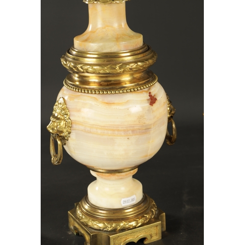 674 - A PAIR OF LATE 19TH CENTURY ONYX AND ORMOLU MOUNTED CASSOLETTES of unusual shape with bulbous bodies... 